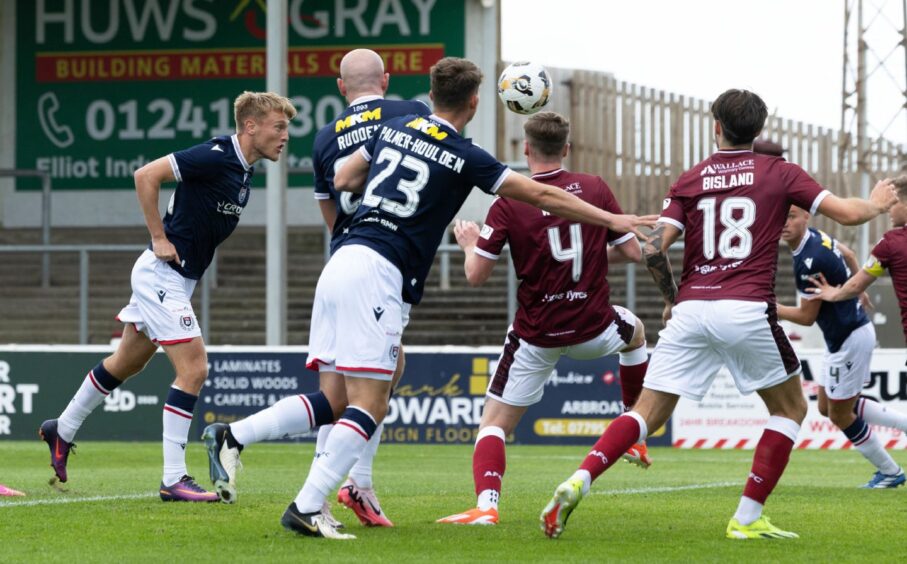 Max Anderson puts Dundee three goals to the good against Arbroath. Image: SNS