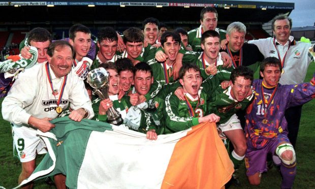 The delirious Irish players celebrate the most unlikely of triumph