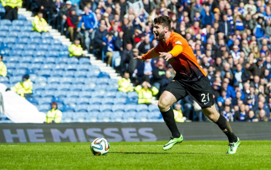 An iconic moment as Nadir Ciftci celebrates against Rangers before putting the ball in the net at Ibrox