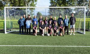 Blairgowrie and Rattray women's football team posing for team photo in goalmouth