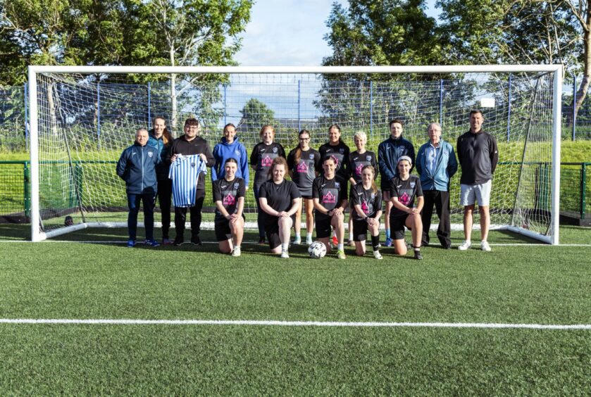 Blairgowrie and Rattray women's football team posing for team photo in goalmouth