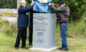 Airfields of Britain Conservation Trust director Kenneth Bannerman (left) leads the Edzell unveiling. Image: Ethan Williams