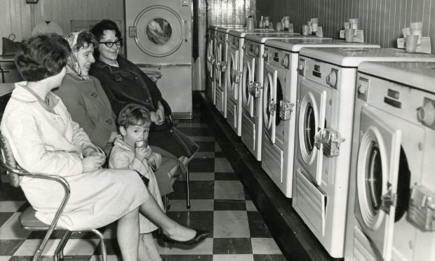 Three women chatting in the Lochee Laundrette. Image: DC Thomson.