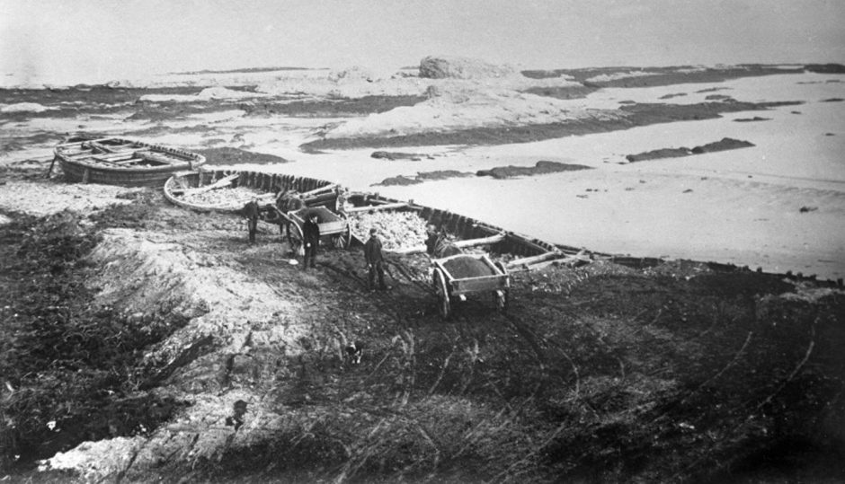 Picture from 1893 of disused St Andrews fishing boats that were put in place and filled with rocks to build the Bruce Embankment and reclaim land so that the golf course and R&amp;A were safe from coastal erosion.