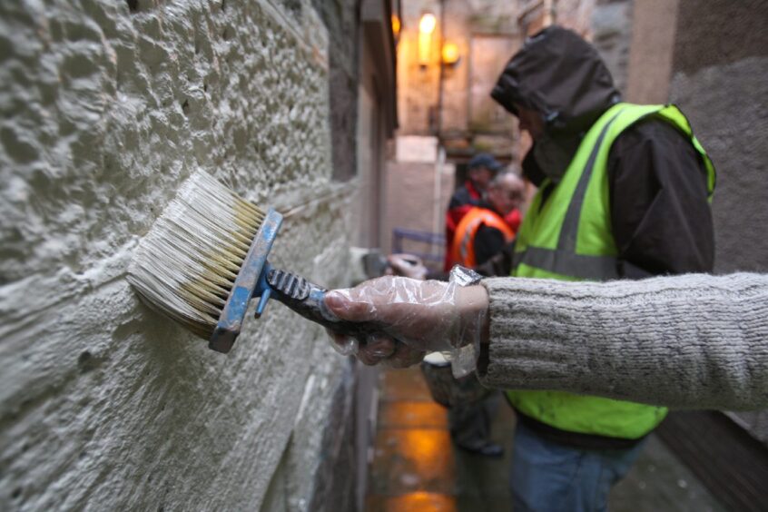 Unpaid worker painting