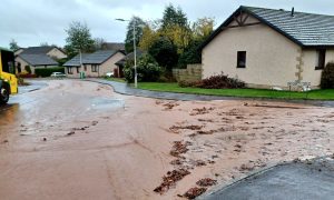 Flash floods pouring mud and water from fields into the Hogarth Drive area of Cupar after an intense downpour in 2022. Image: Michael Alexander