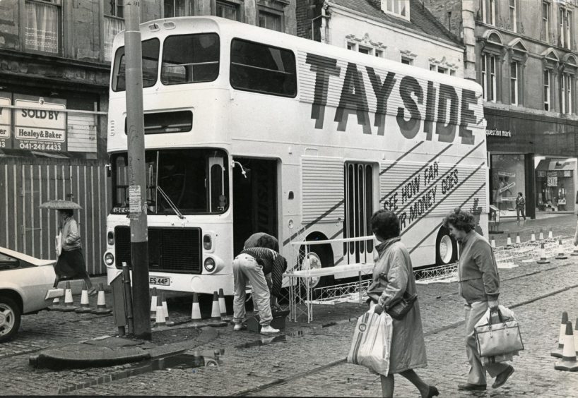Workmen preparing a video bus for visitors to the Tayside 10th anniversary exhibition in August 1985.