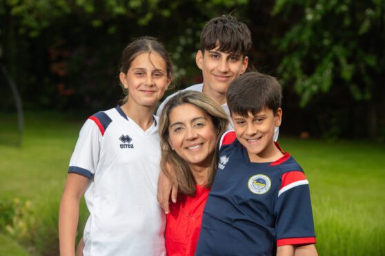 Radiologist Shilpi Szwejkowska with her sons Nathan, back, Sam, right, and daughter Maia.