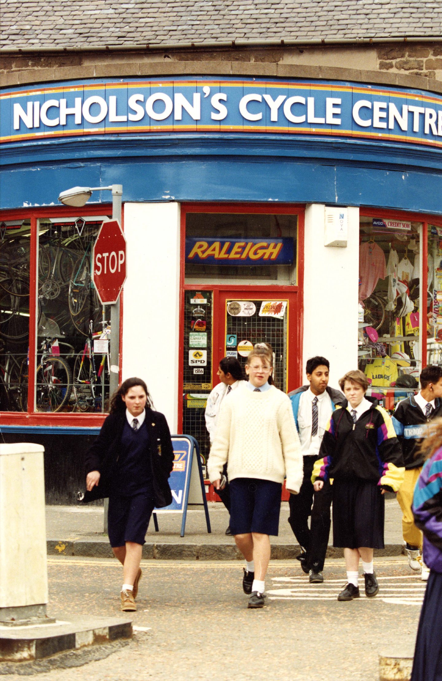 People walk past the outside of Nicholson's cycle centre, which has been on Forfar Road since 1975. 