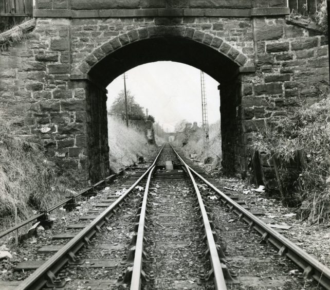 A section of the Downfield railway line as it passes under a bridge 