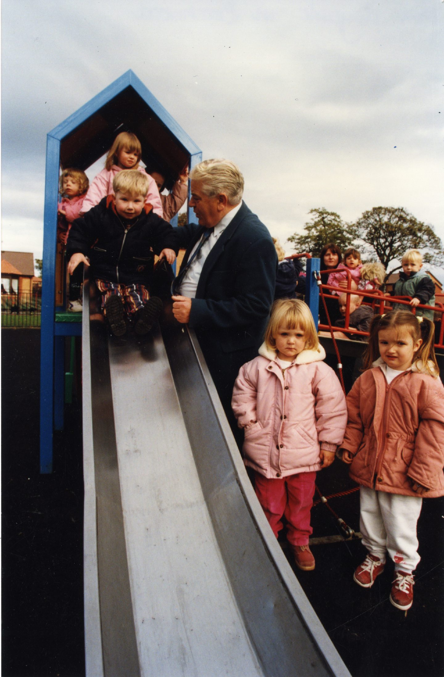 Children on the slide as Councillor Charles Farquhar opens a new playpark in Beechwood in 1996.