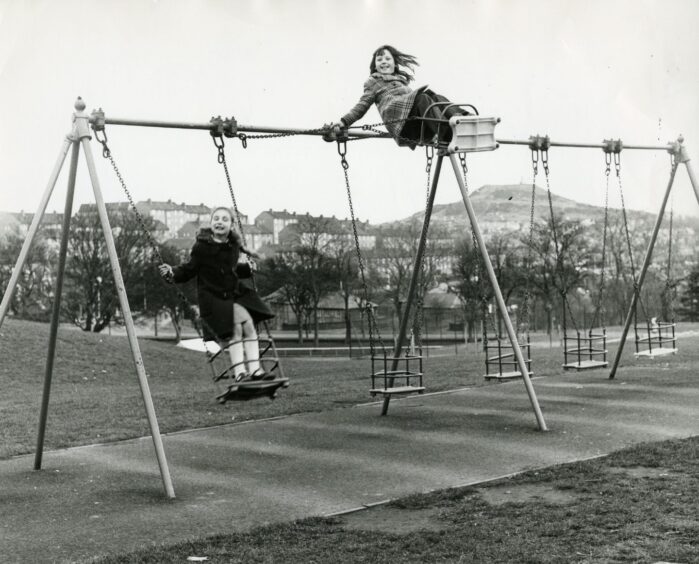 Two girls on the swings at Victoria Park in April 1977.