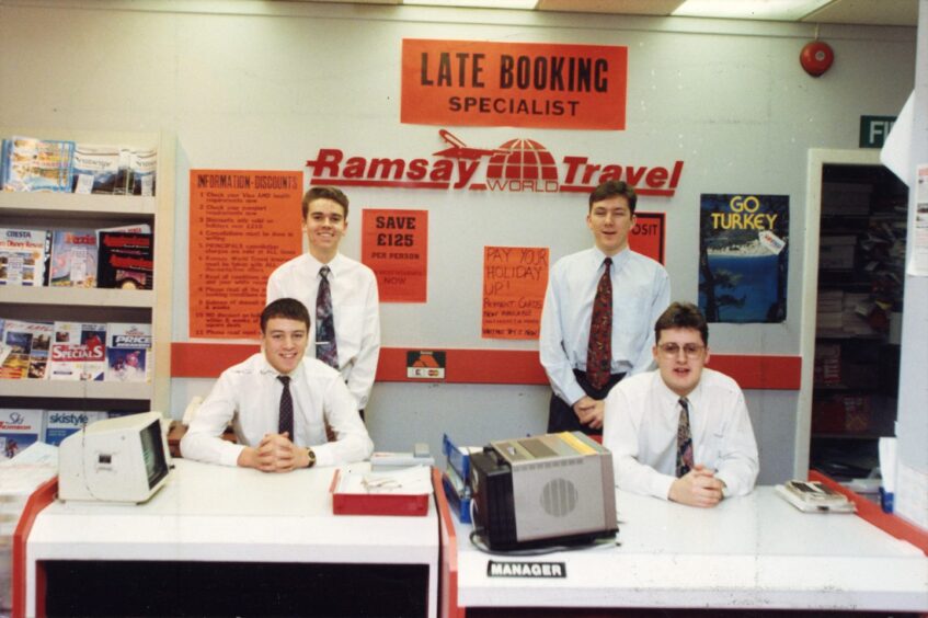 Ramsay staff behind their desks, ready to greet customers. 