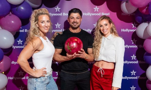 Left to right: Sheli McCoy (Sabre from Gladiators) with Love Island stars Anton Danyluk and Laura Anderson at Hollywood Bowl Dundee. Image: Chris Scott Photography/Stripe Communications