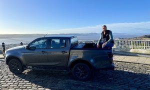 Jack McKeown and the Isuzu D-Max at the top of Dundee Law, with the River Tay in the background