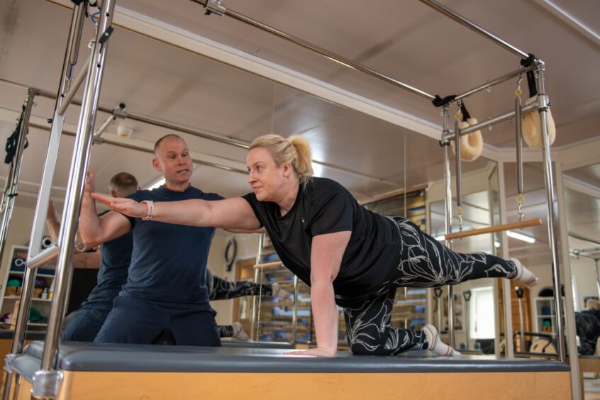 Debbie doing mat pilates.