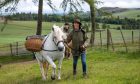 Gayle leads Highland pony mare Phosa as part of Kinclune Estate's experience. Image: Kim Cessford/ DC Thomson.