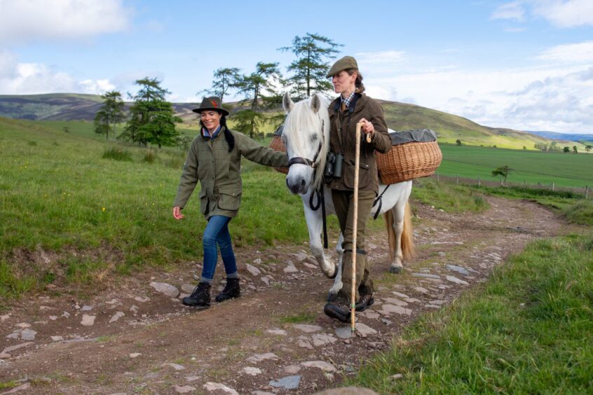 Gayle and Virginia lead Highland pony Phosa into the Angus wilderness. Image: Kim Cessford.