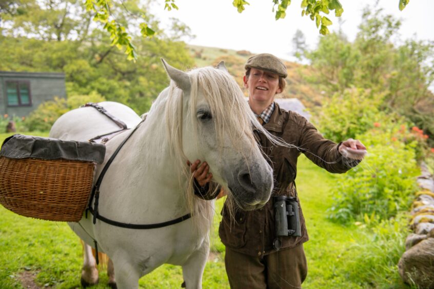 Virginia Osborne-Antolovi prepares 'Phosa' for the trek into the hills. Image: Kim Cessford.