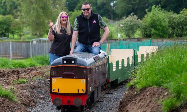 Scottish Deer Centre owner David Hamilton and manager Sarah Rice try out the new miniature train.