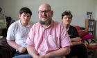 Dundee dad Ewan Sutherland with his sons Leo, 17, and Jacob, 15. Image: Kenny Smith/DC Thomson.