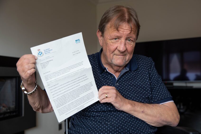 East Wemyss man Andy Mitchell with his letter from the Scottish Ambulance Service.