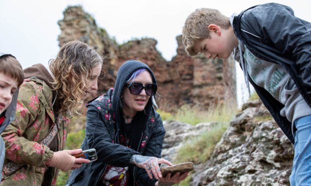 Cheryl, Katie and Alex looking for fossils on Fife beach.