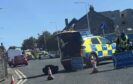Police close St Clair Street in Kirkcaldy after car flips onto roof in crash.