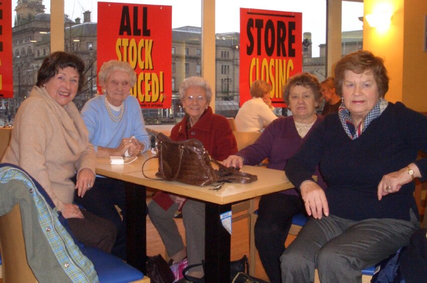 These five women enjoy their last coffee in the café before closure. 