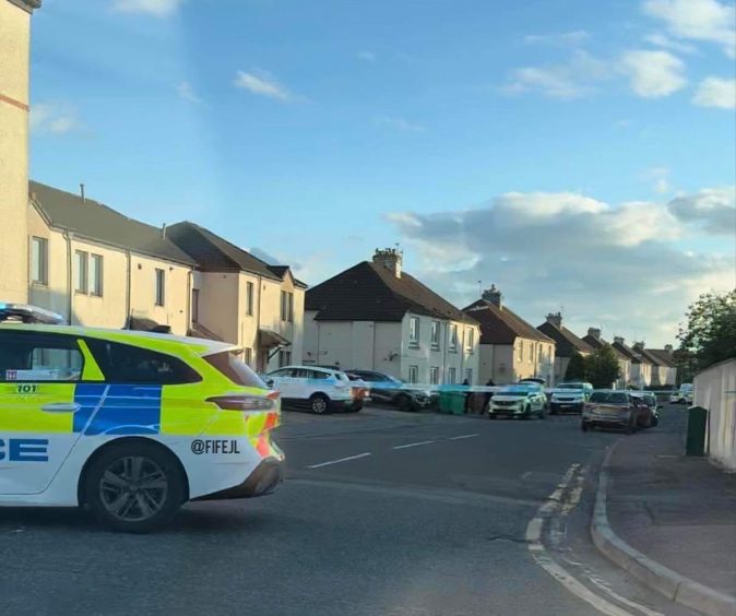 Police have taped off a section of the Leven street.