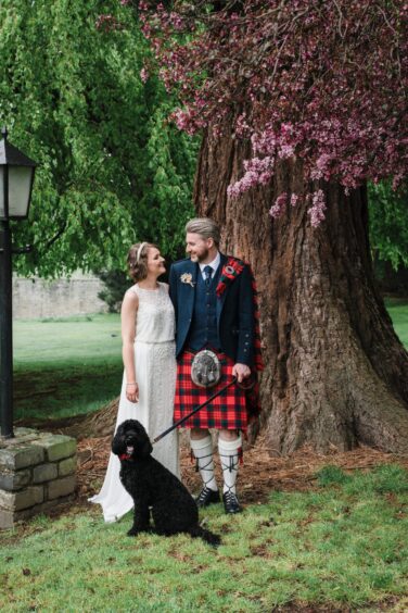 Love is in the air for Laura and Jamie Fyfe - and their Cockpoo Jasper! Image: Andi Watson Photography. 