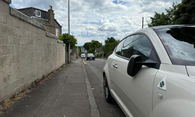 One of the damaged cars on Mains Loan.