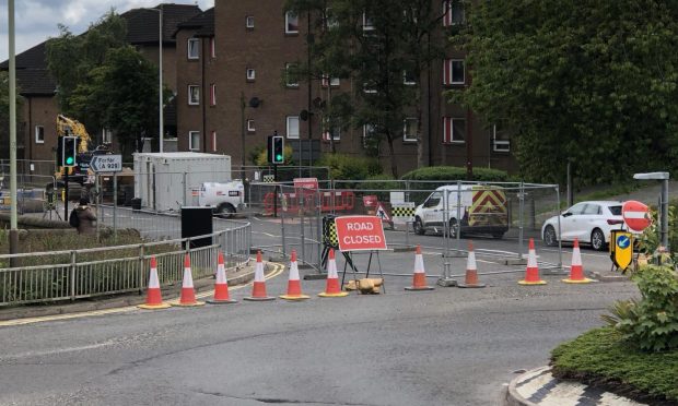 A section of dens Road in Dundee will remain closed for an extra month.