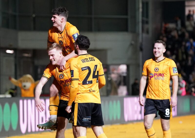 Palmer-Houlden celebrates with team-mate Will Evans as Newport equalised against Manchester United. Image: PA