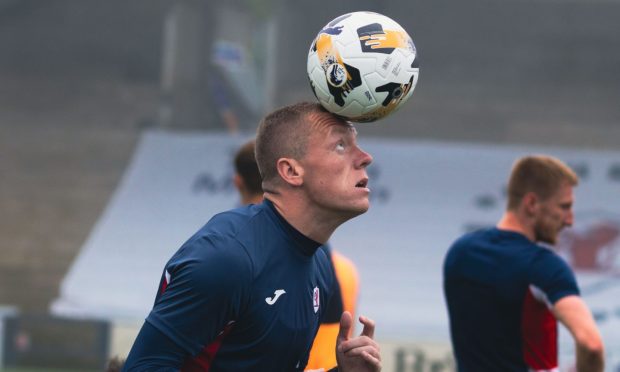 Raith Rovers skipper Scott Brown heads a ball in training.