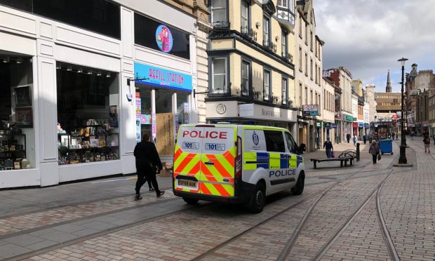 Police outside the Refill Station on Murraygate in Dundee on Tuesday after the break-in. Image: James Simpson/DC Thomson