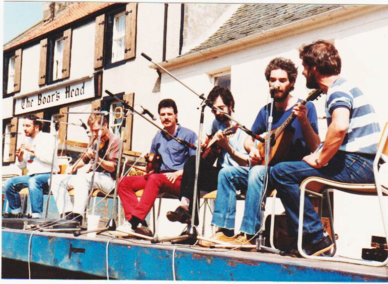 The band Jock Tamson's Bairns playing outside the Boar's Head pub, Auchtermuchty, in the 1980s