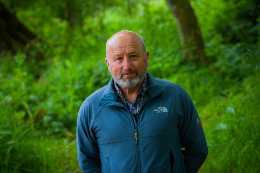 Peter Lock standing among greenery beside River Ericht