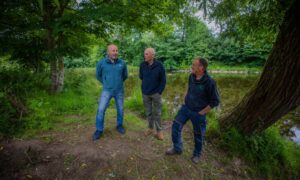 Peter Lock , David Hogg and Robert Kellie standing on river bank at Blairgowrie