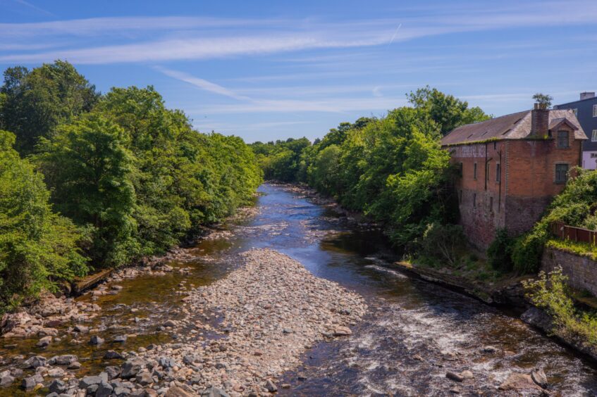 River Ericht with converted mill building alongside