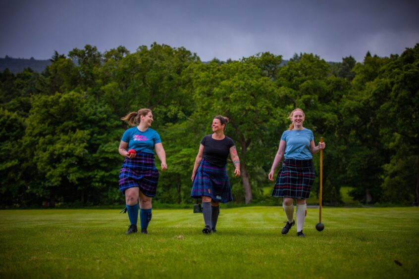 Highland Games competitors, from left to right, Laura Barber, Rebecca Maeule and Ruadh McIntosh in Pitlochry Recreation Ground. Image: Steve MacDougall.