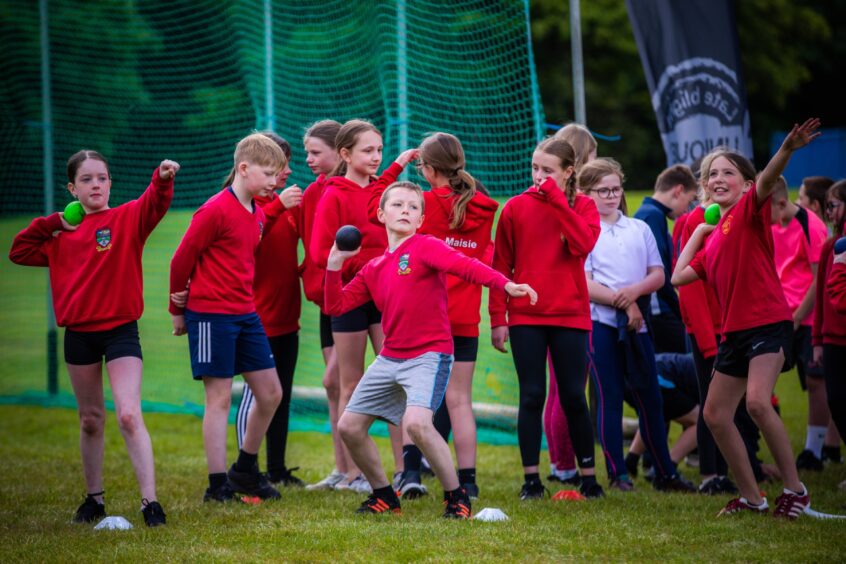 Shot put at Glamis Castle junior games.