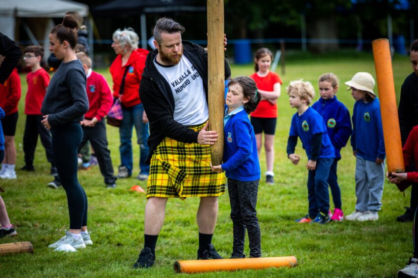 Caber tossing at Glamis junior highland games.