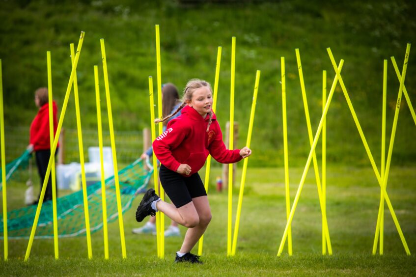 Obstacle course action at Glamis Castle junior highland games.