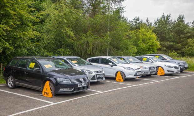 Six cars in a row all clamped.