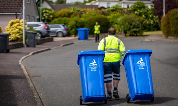 New blue bins for paper and card being rolled out to houses in Monifieth. Image: Steve Brown/DC Thomson