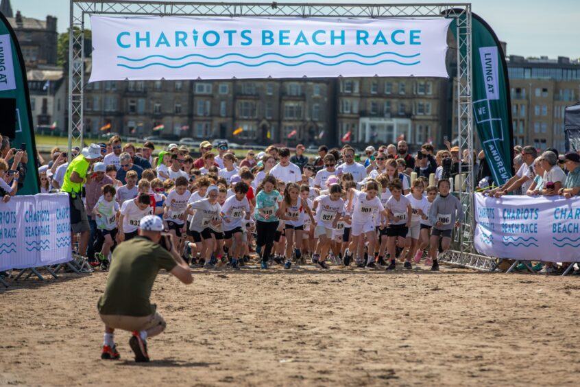 Chariots of fire beach race in St Andrews. Children's race gets under way