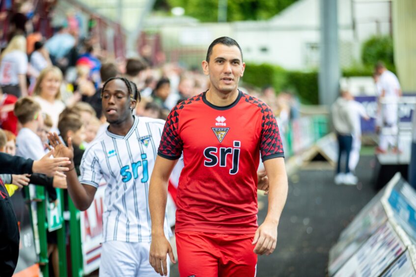 Deniz Mehmet sports the new Dunfermline goalkeeper's kit.