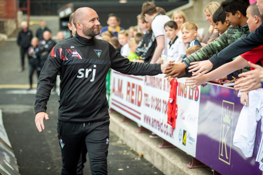 Dunfermline Athletic FC manager James McPake meets young supporters.