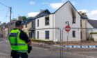 Police outside the fire-hit property in Western Avenue, Milnathort. Saturday 1st June 2024. Image: Steve Brown/DC Thomson